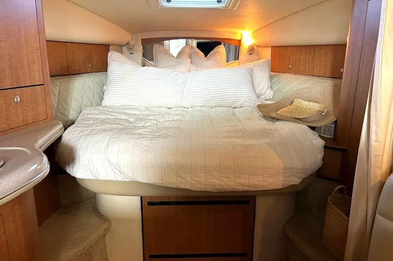Slide: The Image of Interior cabin of 2006 Sea Ray Sundancer 320 with cozy bed and soft lighting. - 47