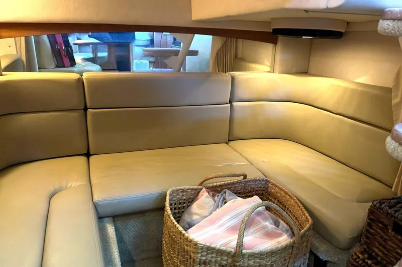 Slide: The Image of Interior of 2006 Sea Ray Sundancer 320 with beige seating and wicker basket. - 49