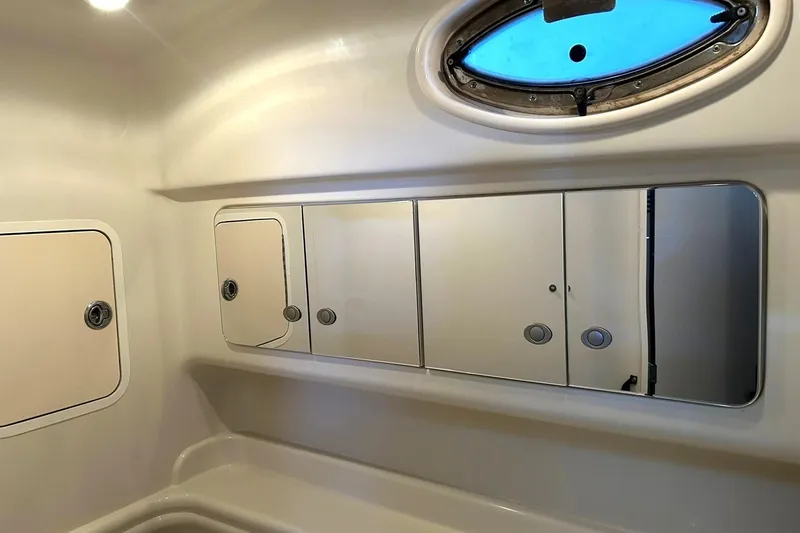 Slide: The Image of Interior of 2006 Sea Ray Sundancer 320 bathroom with mirrors and storage compartments. - 54