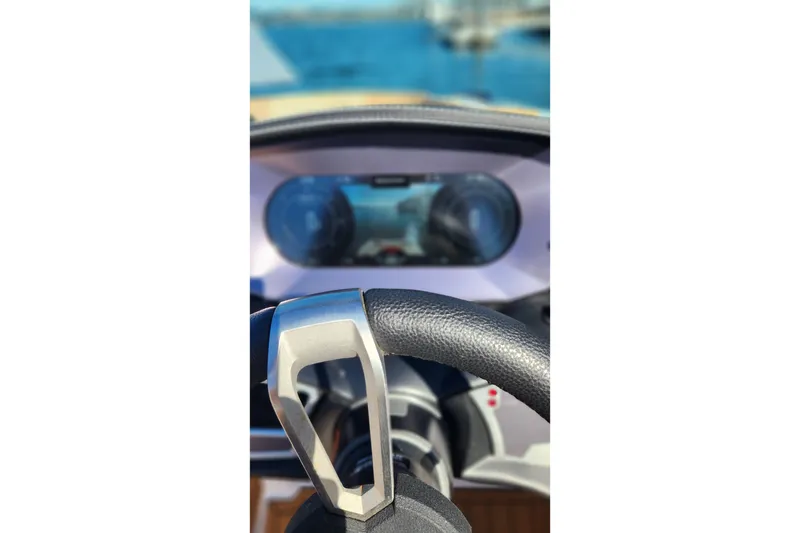 Slide: The Image of Steering wheel of 2024 MasterCraft X24 boat with dashboard view. - 17