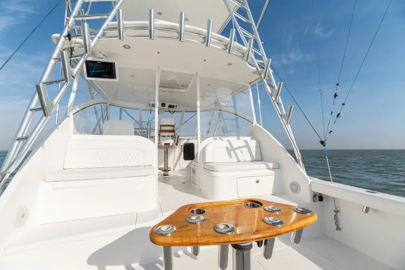 Slide: The Image of 2015 Ocean Yachts 37 Express boat interior with seating and fishing rod holders. - 10