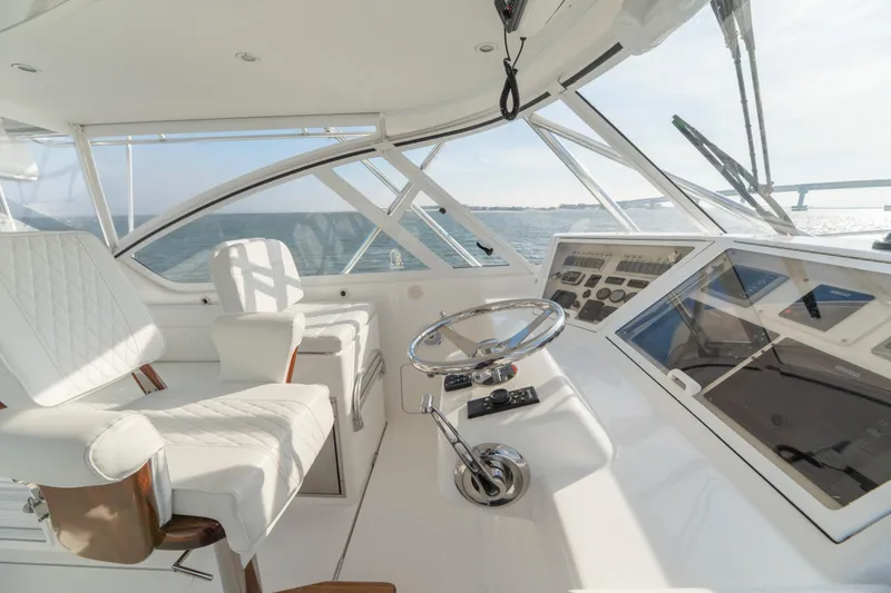 Slide: The Image of Luxurious 2015 Ocean Yachts 37 Express cockpit with modern controls and panoramic ocean view. - 14