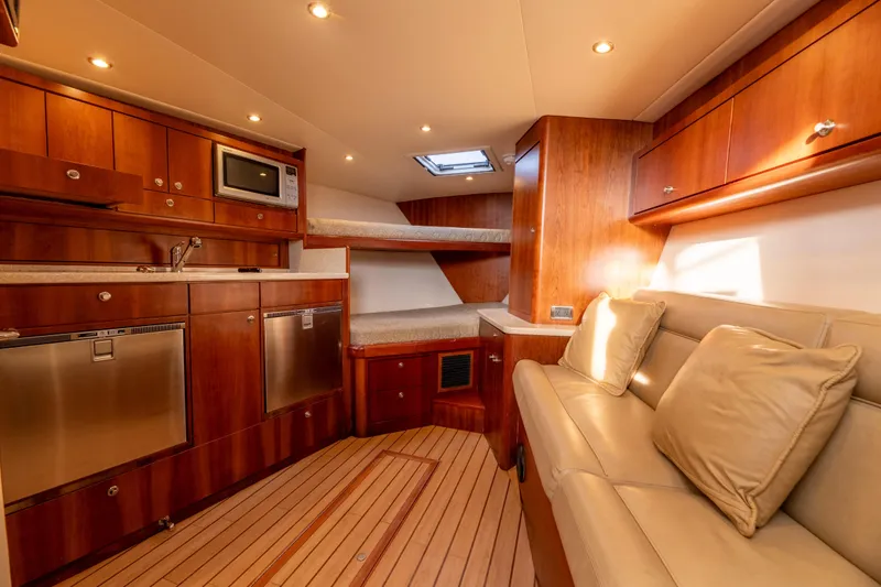 Slide: The Image of Luxurious interior of 2015 Ocean Yachts 37 Express, featuring wood cabinetry and modern amenities. - 16