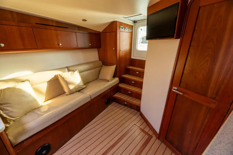 Slide: The Image of Luxurious interior of 2015 Ocean Yachts 37 Express with wooden finishes and cozy seating. - 17
