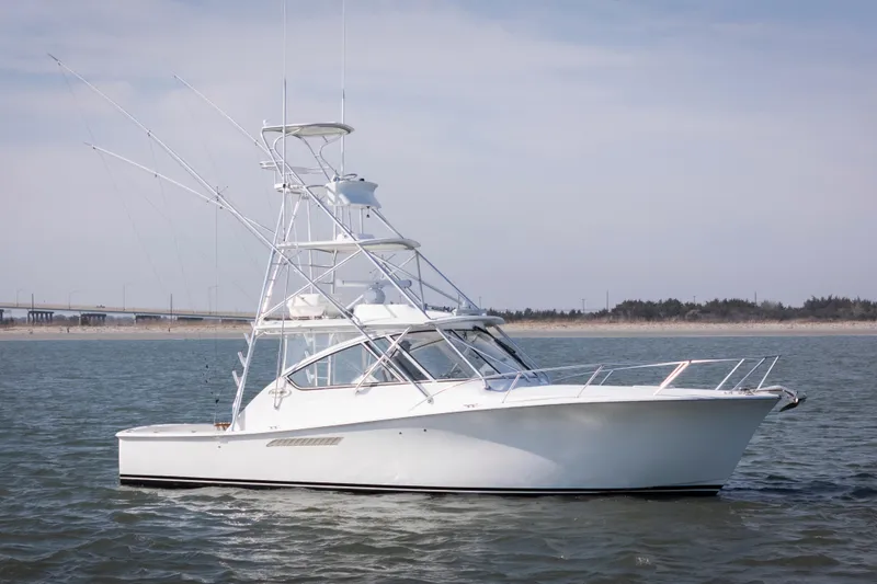 Slide: The Image of 2015 Ocean Yachts 37 Express boat cruising on open water. - 2