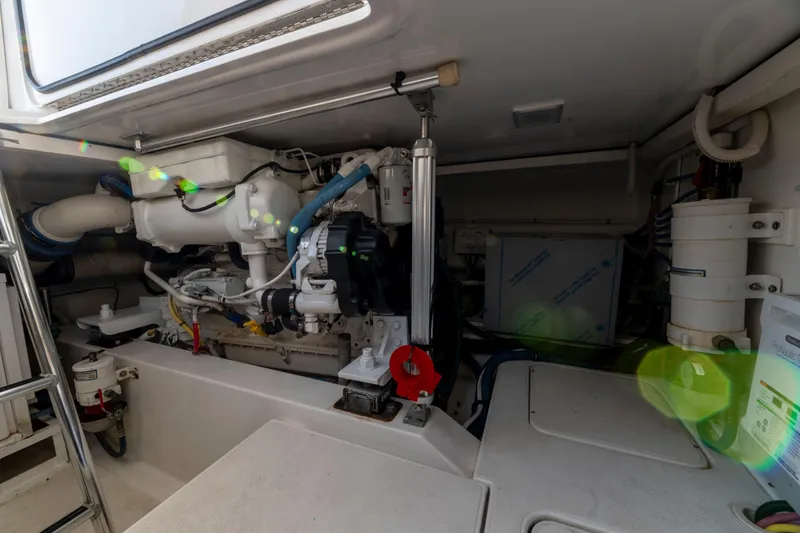 Slide: The Image of Engine room of a 2015 Ocean Yachts 37 Express, showcasing mechanical components. - 21