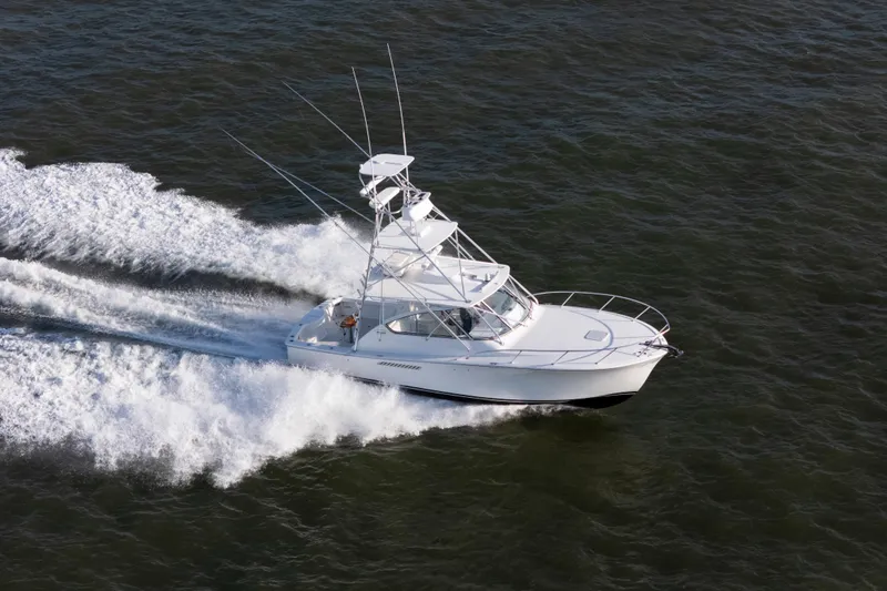 Slide: The Image of 2015 Ocean Yachts 37 Express cruising swiftly on open water. - 22