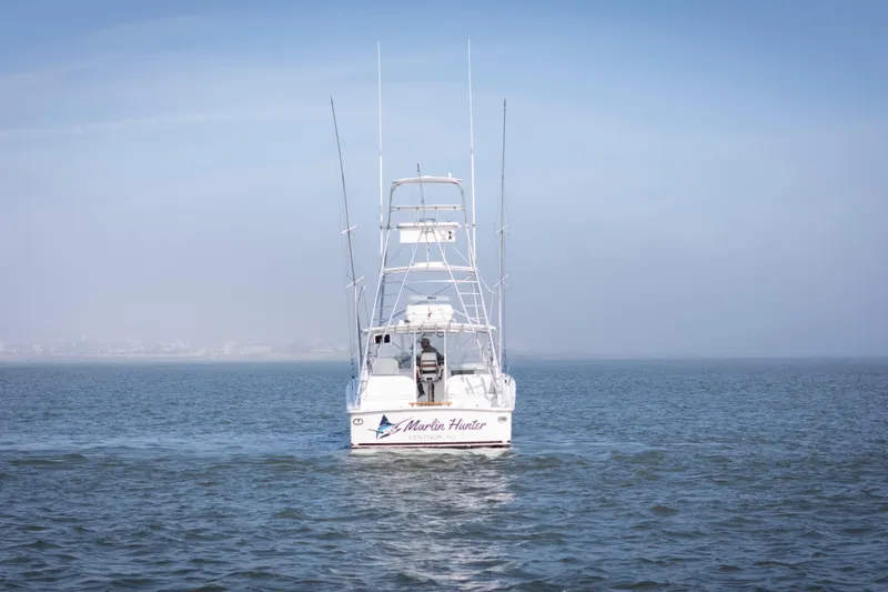 Slide: The Image of Ocean Yachts 37 Express 2015 boat on calm water, rear view. - 3