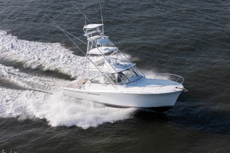 Slide: The Image of 2015 Ocean Yachts 37 Express cruising swiftly on open water. - 4