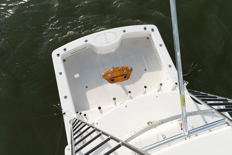 Slide: The Image of 2015 Ocean Yachts 37 Express fishing deck with rod holders and ladder. - 8