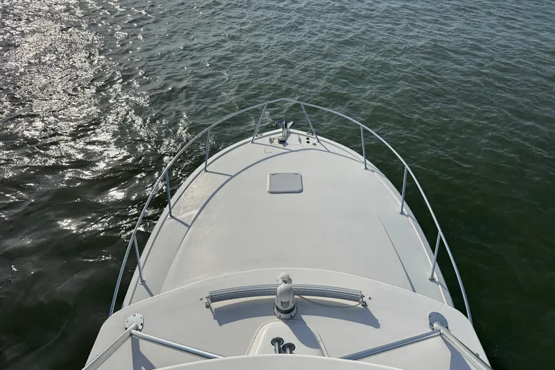 Slide: The Image of Bow view of 2015 Ocean Yachts 37 Express on calm water. - 9