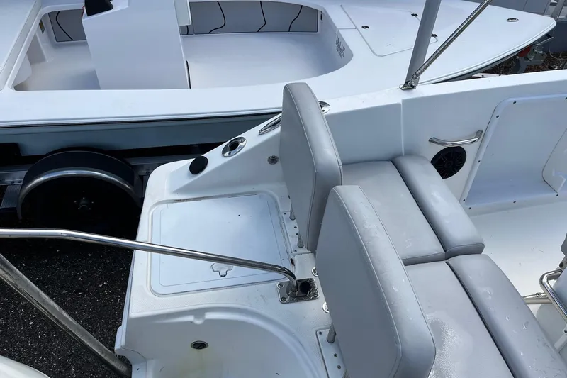 Slide: The Image of 2020 Hurricane Center Console 19 OB boat interior with gray seating and white deck. - 10