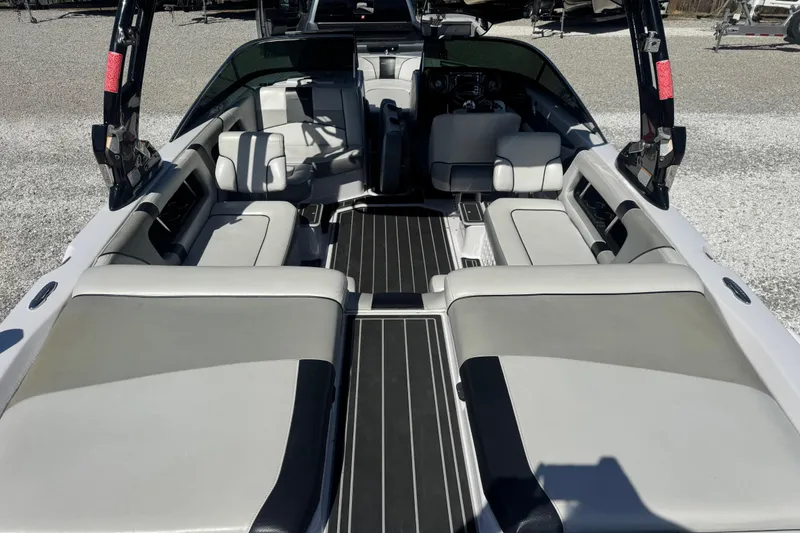 Slide: The Image of 2011 Nautique Super Air Nautique 230 interior with spacious seating and sleek design. - 12