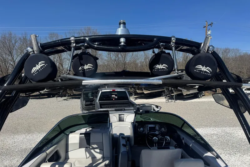 Slide: The Image of 2011 Nautique Super Air Nautique 230 boat with Wet Sounds speakers and sleek interior design. - 14