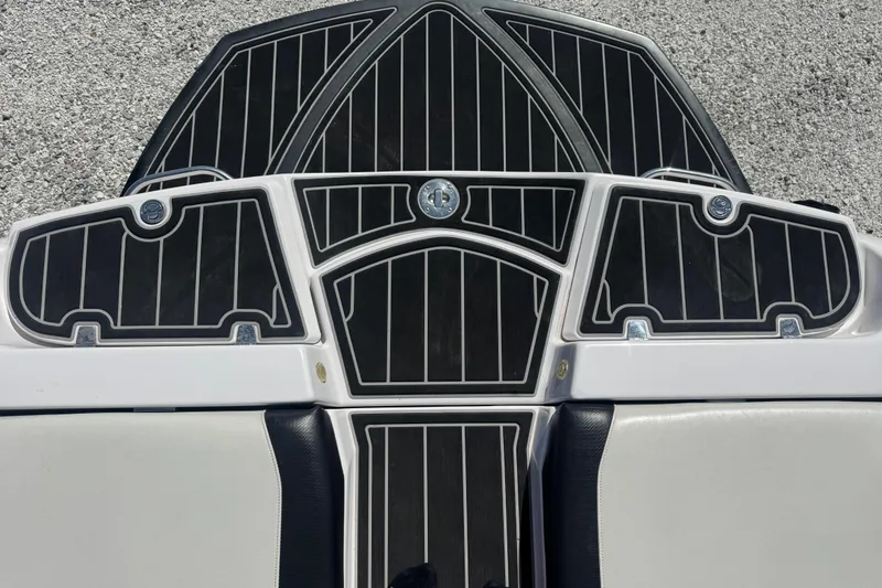 Slide: The Image of 2011 Nautique Super Air Nautique 230 boat deck with black and white detailing. - 15