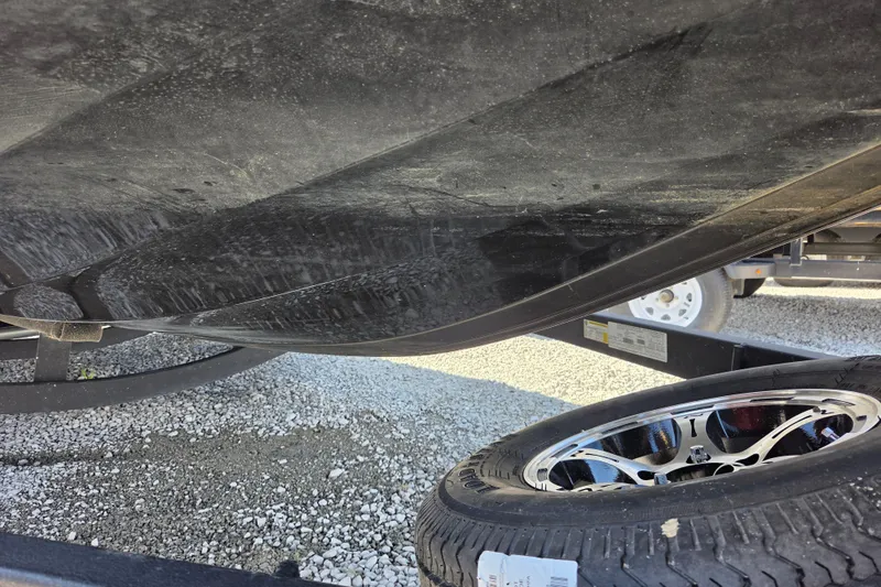 Slide: The Image of Underside of a 2023 Nitro Z20 boat with trailer and tire visible. - 14