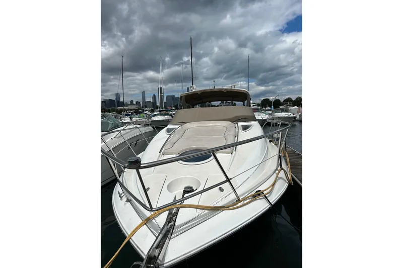 Slide: The Image of 2001 Doral 330se boat docked at marina under cloudy sky. - 3