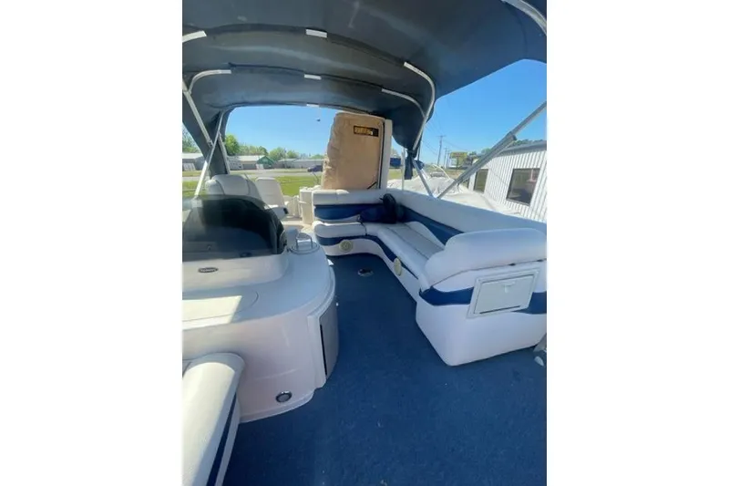 Slide: The Image of 2009 Premier 221 Cast-A-Way boat interior with seating and canopy. - 3