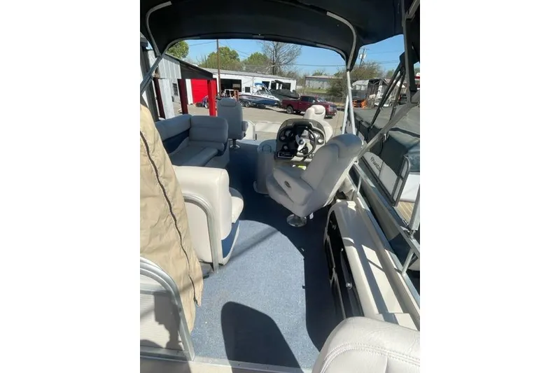 Slide: The Image of Interior view of a 2009 Premier 221 Cast-A-Way boat with seating and steering console. - 4