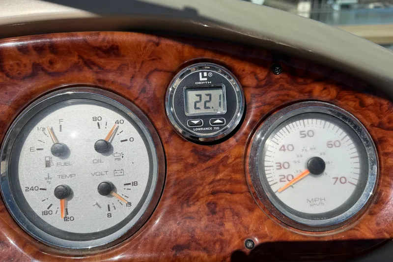 Slide: The Image of Dashboard of 2003 Rinker 282 Captiva Bowrider with gauges and depth meter. - 11