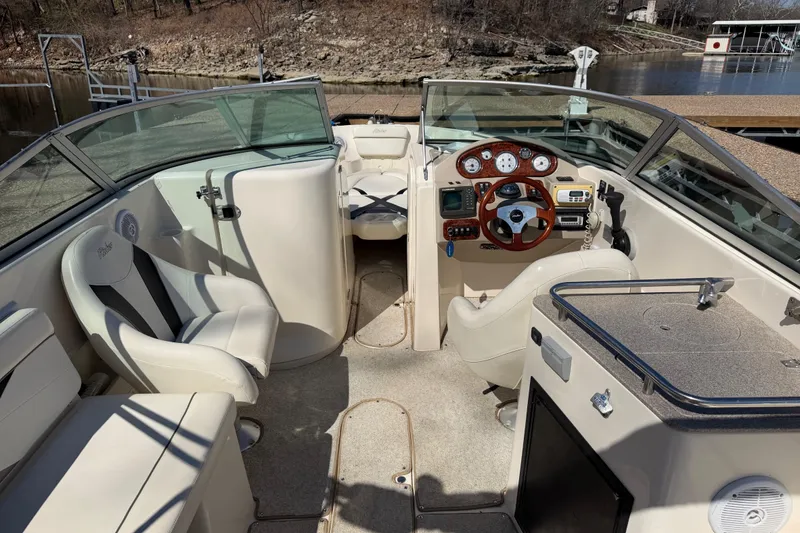 Slide: The Image of 2003 Rinker 282 Captiva Bowrider interior with steering wheel and seating. - 14