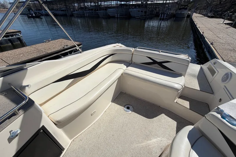 Slide: The Image of 2003 Rinker 282 Captiva Bowrider interior with spacious seating and waterfront view. - 18