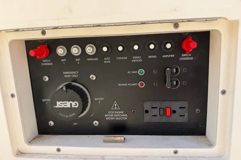 Slide: The Image of Control panel of a 2003 Rinker 282 Captiva Bowrider boat with various switches and indicators. - 7