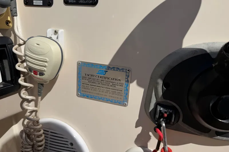 Slide: The Image of Control panel of a 2003 Rinker 282 Captiva Bowrider with yacht certification plaque. - 9