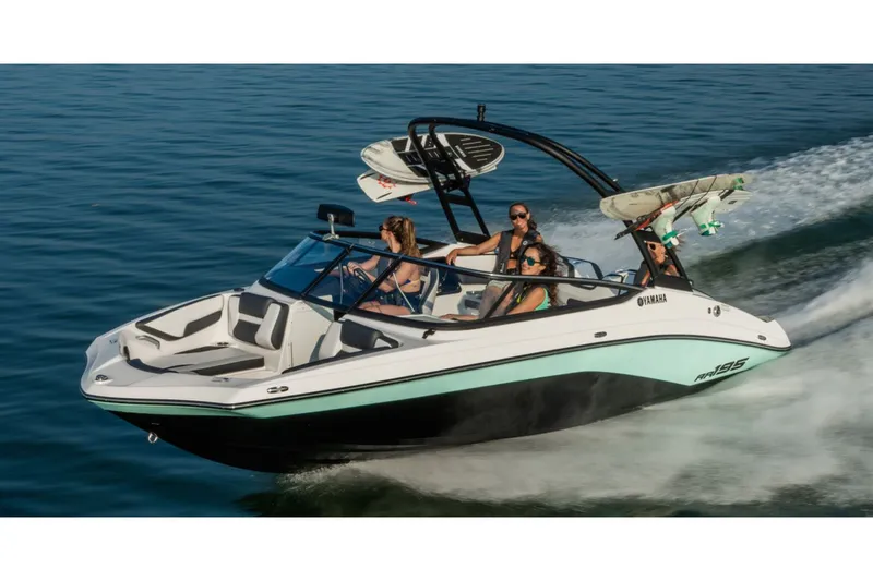 Slide: The Image of 2026 Yamaha AR195 boat cruising on water with passengers. - 9
