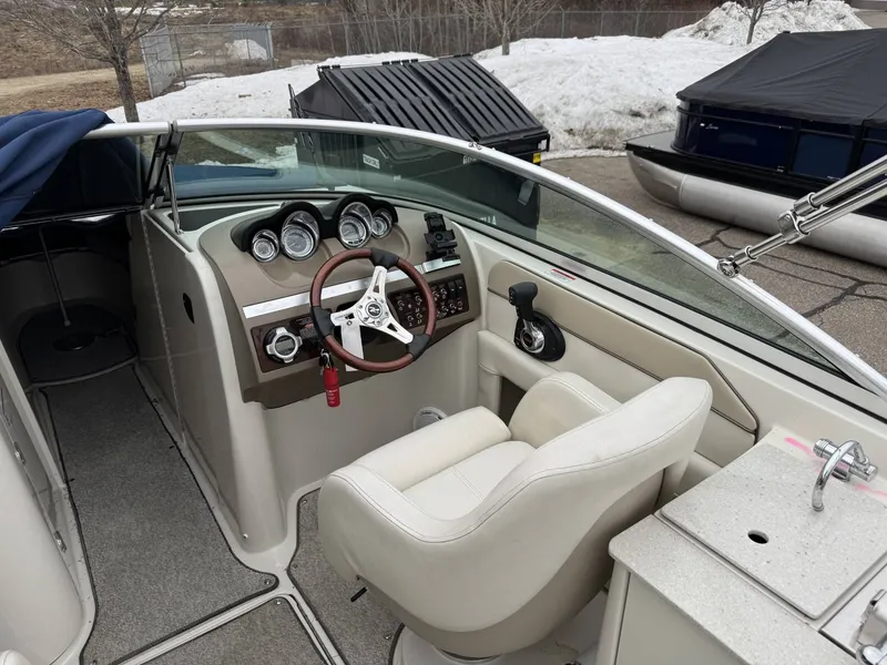 Slide: The Image of Interior view of a 2010 Sea Ray 280SD boat cockpit. - 10