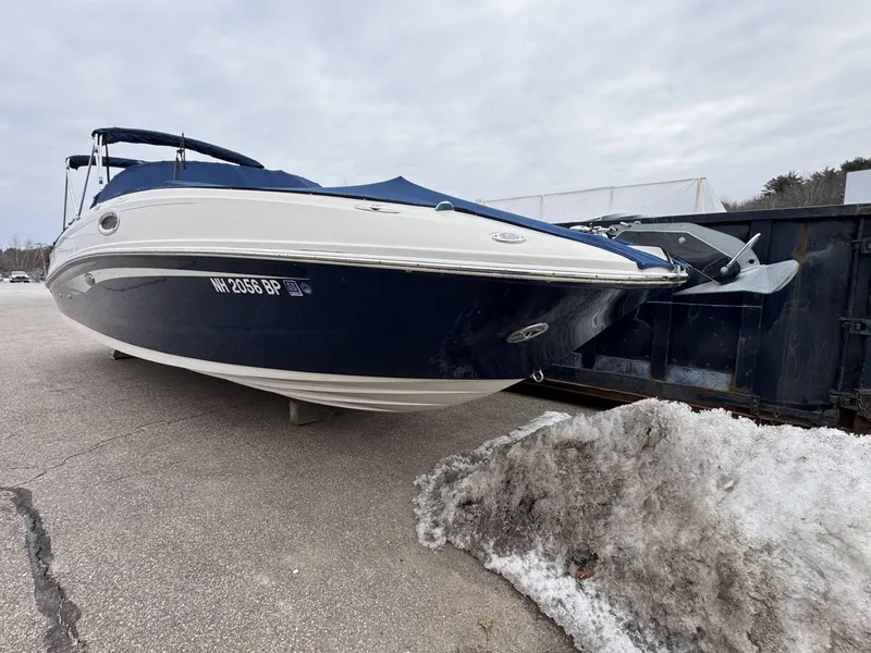 Slide: The Image of 2010 Sea Ray 280SD boat parked on snowy pavement. - 5