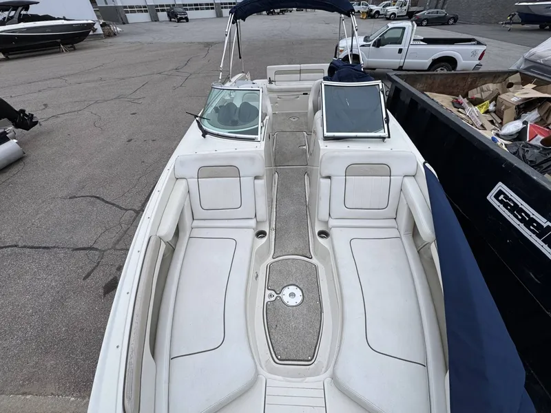 Slide: The Image of Interior view of a 2010 Sea Ray 280SD boat on a parking lot. - 6