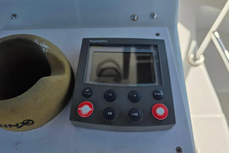 Slide: The Image of Raymarine autopilot control on 2002 Luhrs 34 Convertible boat dashboard. - 10