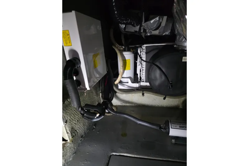 Slide: The Image of Engine compartment of 2002 Luhrs 34 Convertible boat, showing wiring and components. - 15