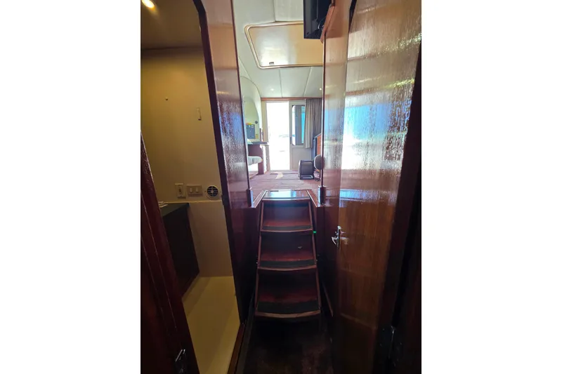 Slide: The Image of Interior view of 2002 Luhrs 34 Convertible yacht with wooden stairs and cabin. - 24