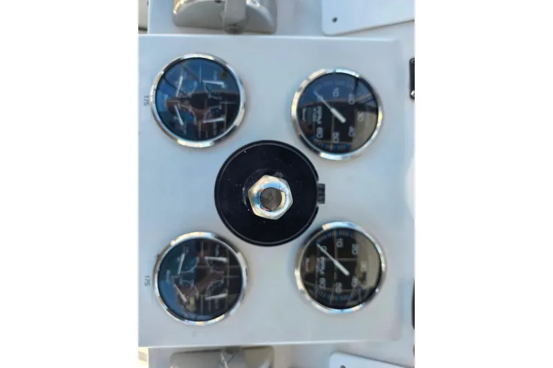 Slide: The Image of Instrument panel of a 2002 Luhrs 34 Convertible boat with gauges. - 9