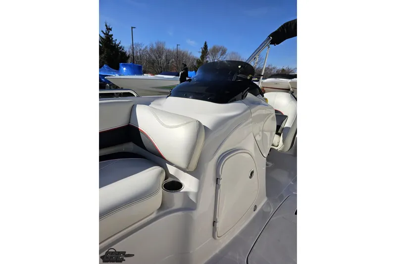 Slide: The Image of 2015 Tahoe 215 Xi boat interior with white seating and storage compartment. - 102