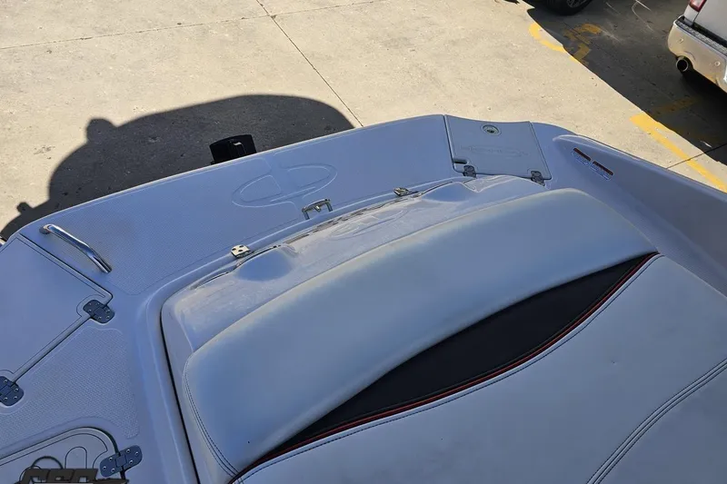 Slide: The Image of 2015 Tahoe 215 Xi boat deck with seating and storage compartments. - 111