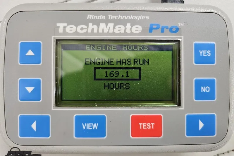 Slide: The Image of TechMate Pro engine hour meter displaying 169.1 hours for 2015 Tahoe 215 Xi. - 114