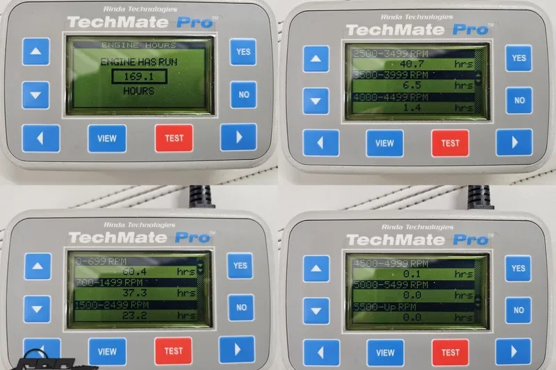 Slide: The Image of TechMate Pro device displaying engine hours and RPM data for 2015 Tahoe 215 Xi. - 115