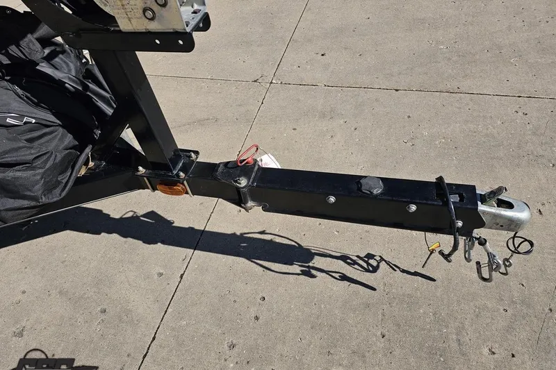 Slide: The Image of Trailer hitch of a 2015 Tahoe 215 Xi boat on concrete surface. - 19