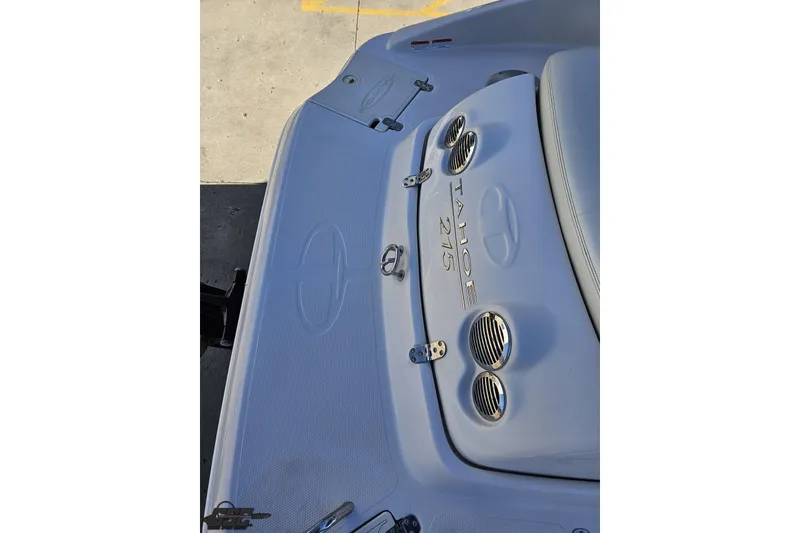 Slide: The Image of 2015 Tahoe 215 Xi boat deck with logo and ventilation details. - 43