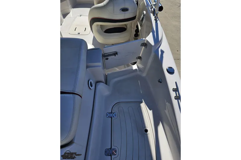 Slide: The Image of 2015 Tahoe 215 Xi boat interior with seating and storage compartments. - 48