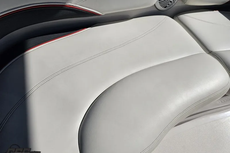 Slide: The Image of 2015 Tahoe 215 Xi boat interior with sleek white leather seating. - 56
