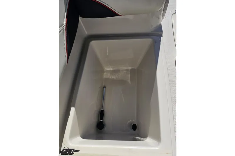 Slide: The Image of Storage compartment in a 2015 Tahoe 215 Xi boat, featuring a hydraulic lift. - 59