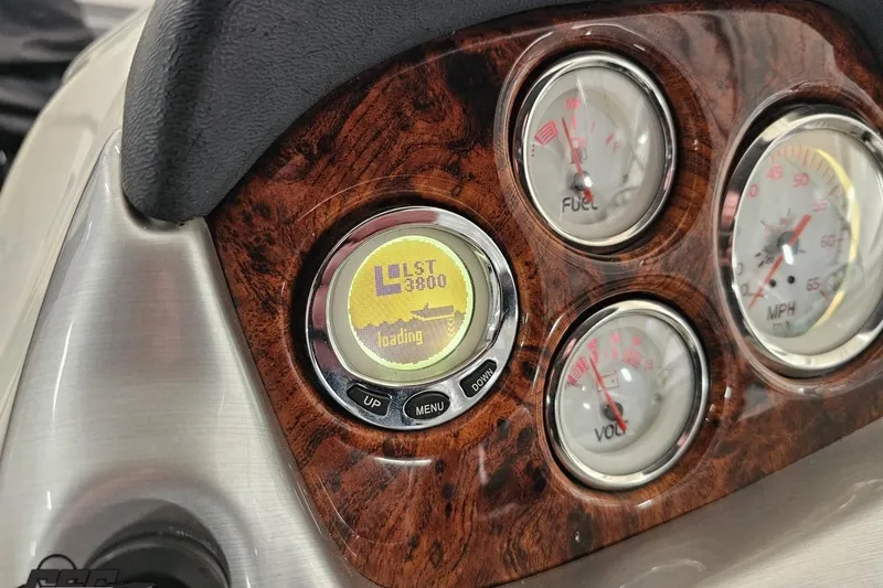 Slide: The Image of Dashboard of a 2015 Tahoe 215 Xi boat with gauges and digital display. - 70