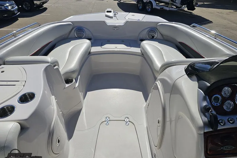 Slide: The Image of Interior of a 2015 Tahoe 215 Xi boat with sleek seating and dashboard. - 72