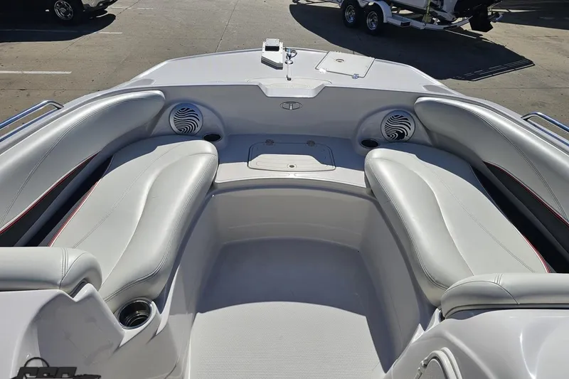 Slide: The Image of 2015 Tahoe 215 Xi boat interior with white seating and built-in speakers. - 73