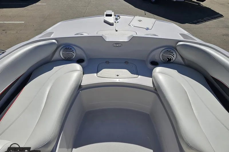 Slide: The Image of 2015 Tahoe 215 Xi boat interior with white seating and built-in speakers. - 74