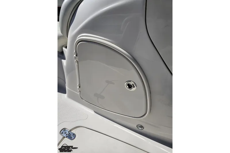 Slide: The Image of 2015 Tahoe 215 Xi boat storage compartment with sleek design and secure lock. - 83